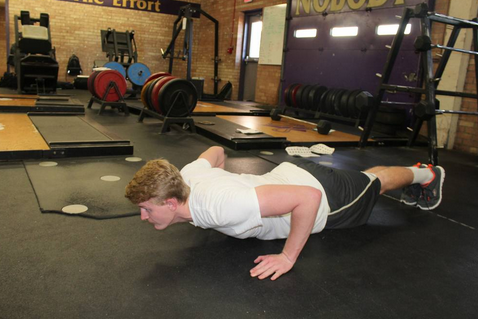 A Student Practices Push Ups