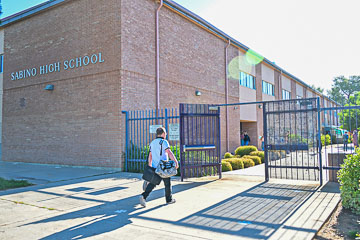 Student entering school on the first day, Aug 3, 2023.