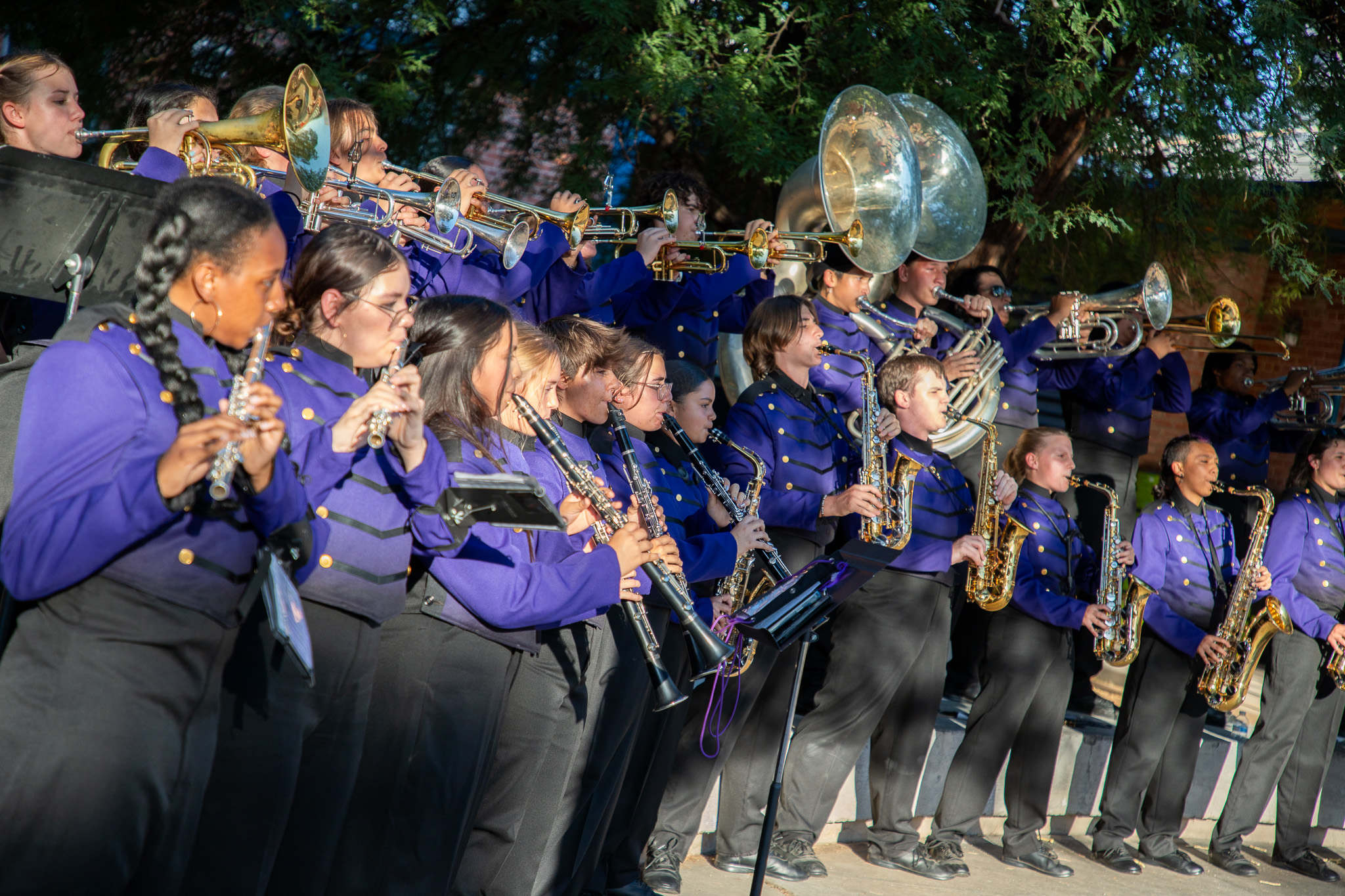 Marching band members perform