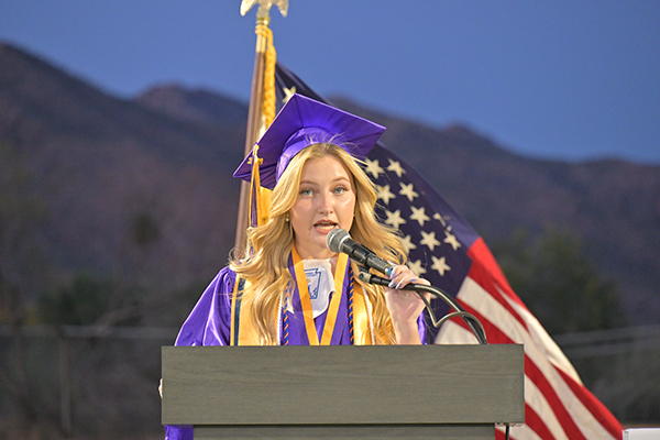 A graduate addresses her class during the ceremony