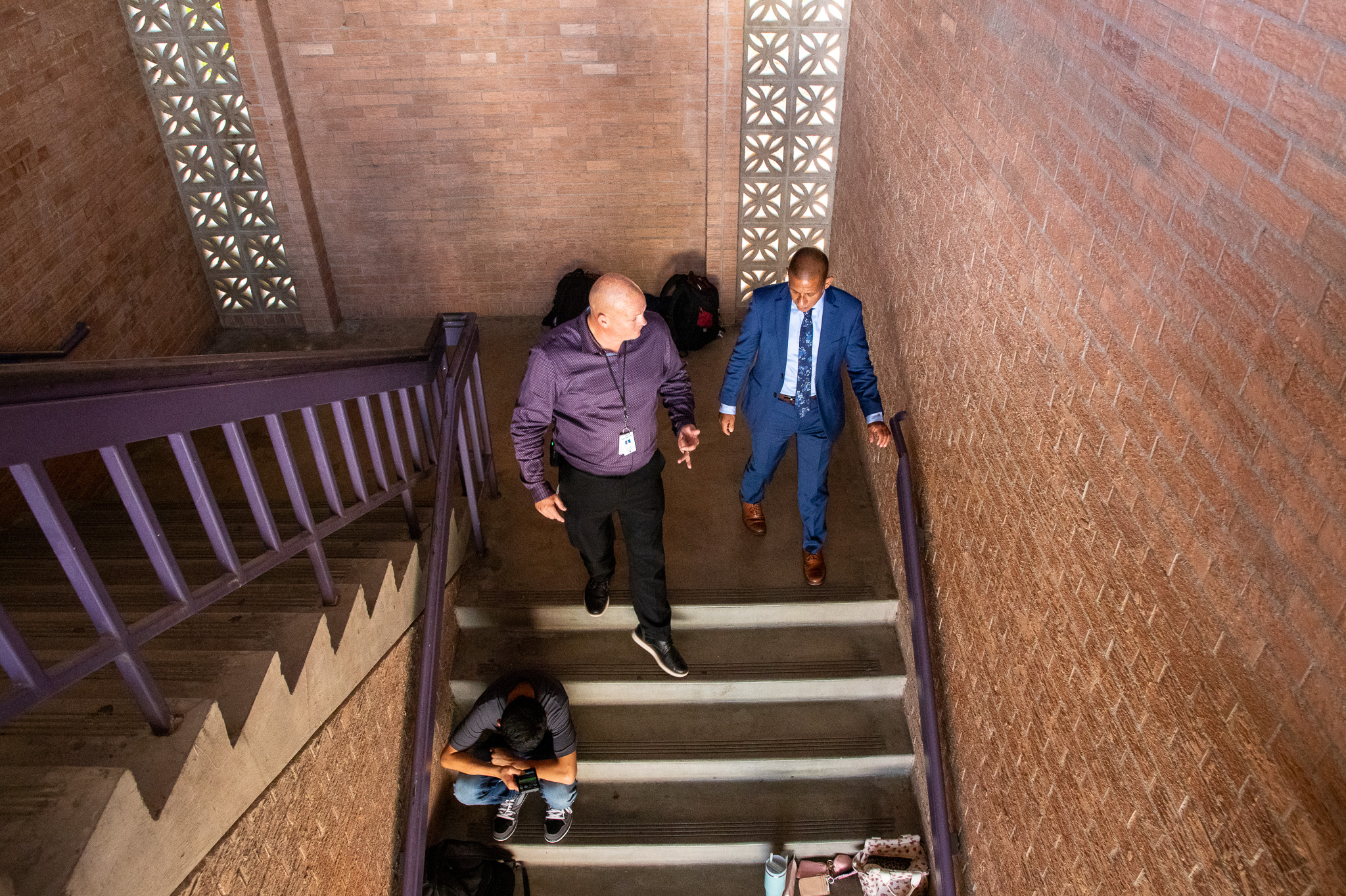 Dr. Trujillo and Sabino's principal walk down the stairs