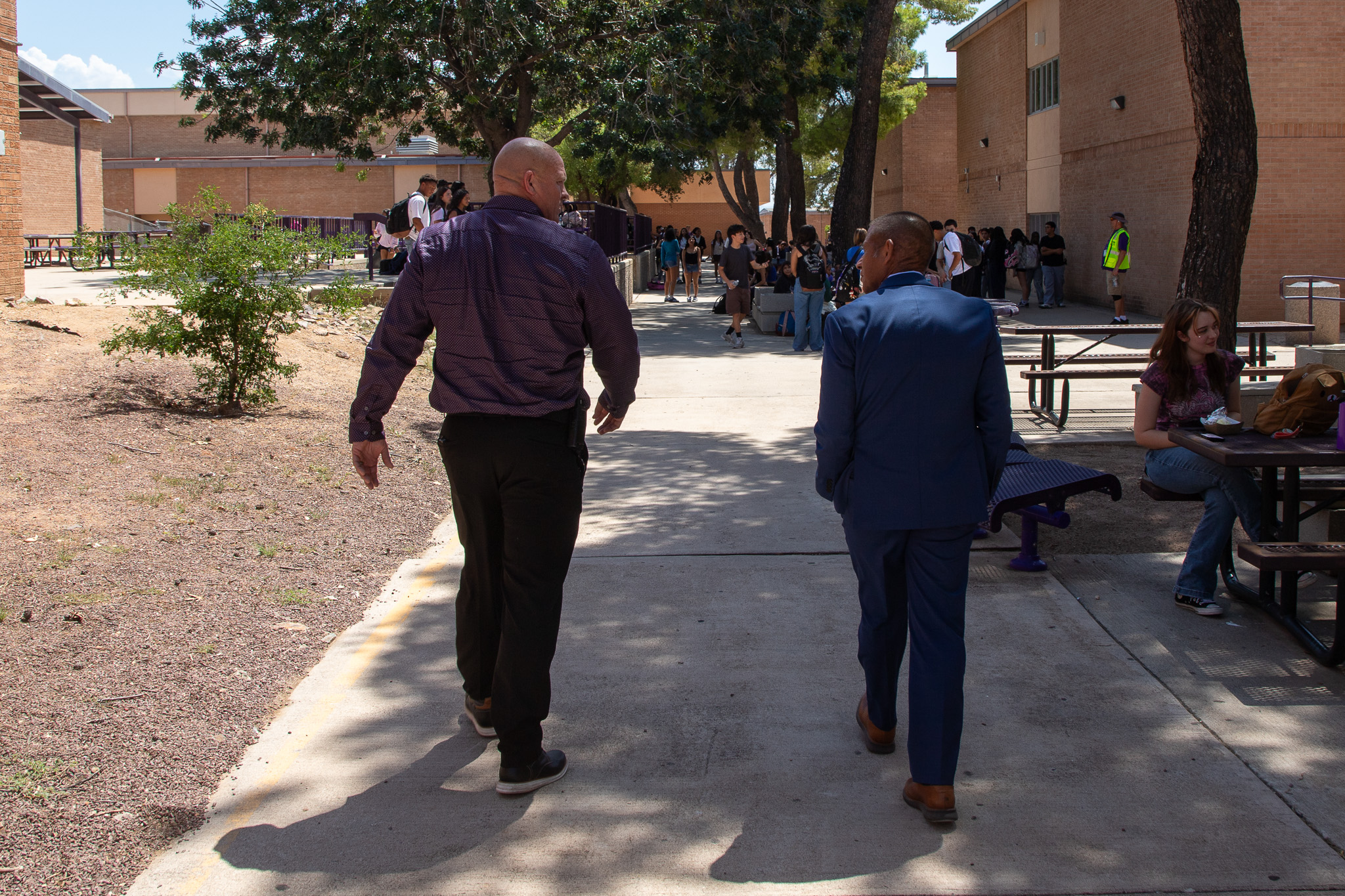 Sabino's principal and Dr. Trujillo walk around campus