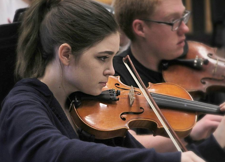 A Student Plays Her Violin