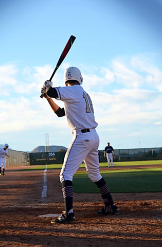 Student with baseball bat during baseball game