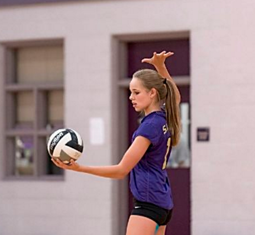 Student playing volleyball