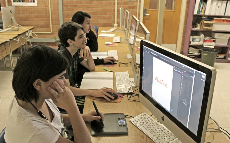 Students at computer working on projects