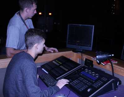 Students Work Together On A SoundBoard In Stage Management